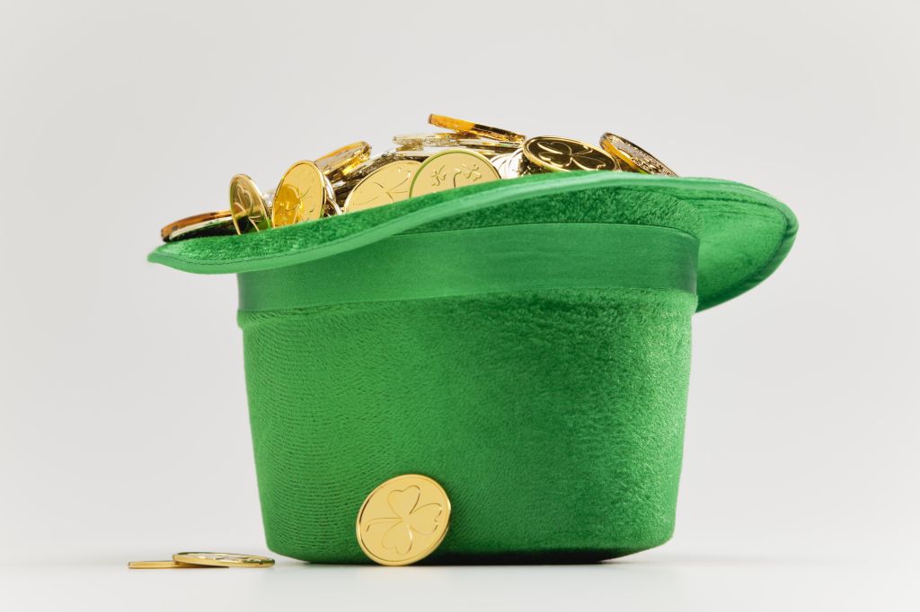 Green hat filled with golden coins