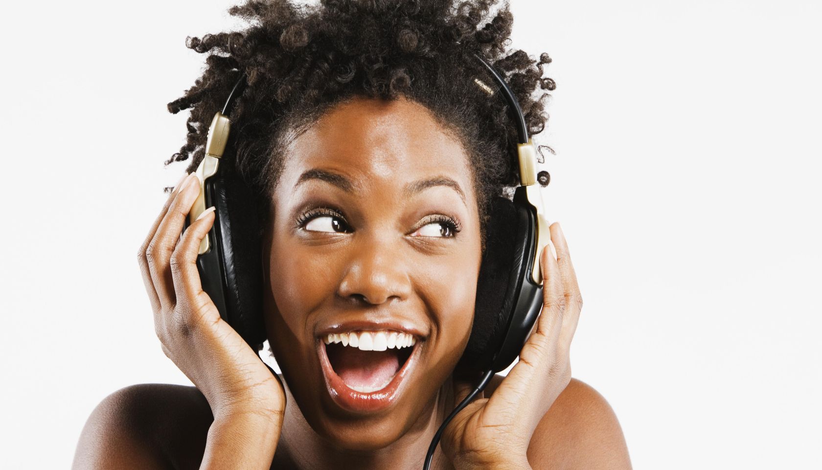 African American woman listening to headphones