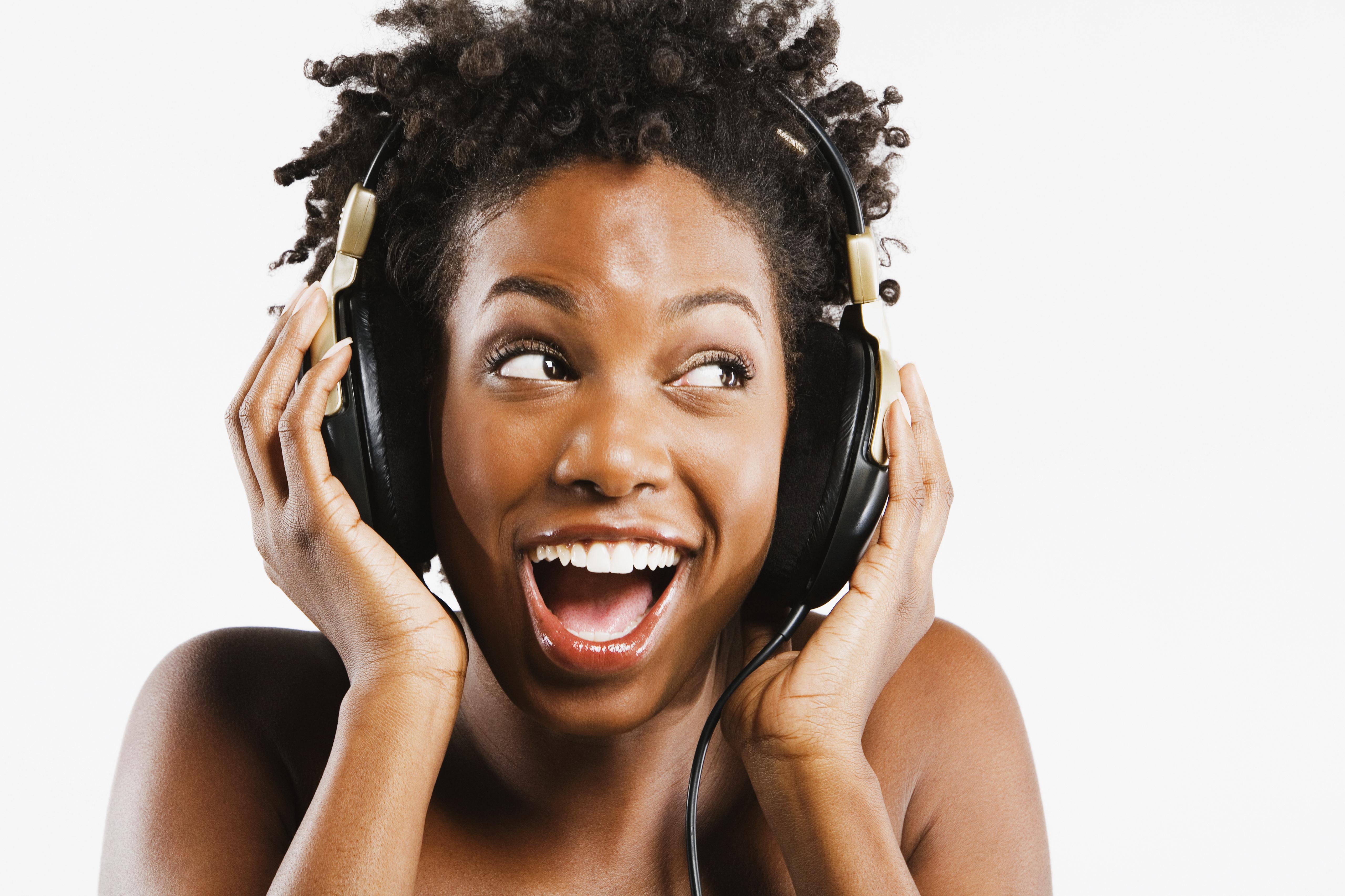African American woman listening to headphones