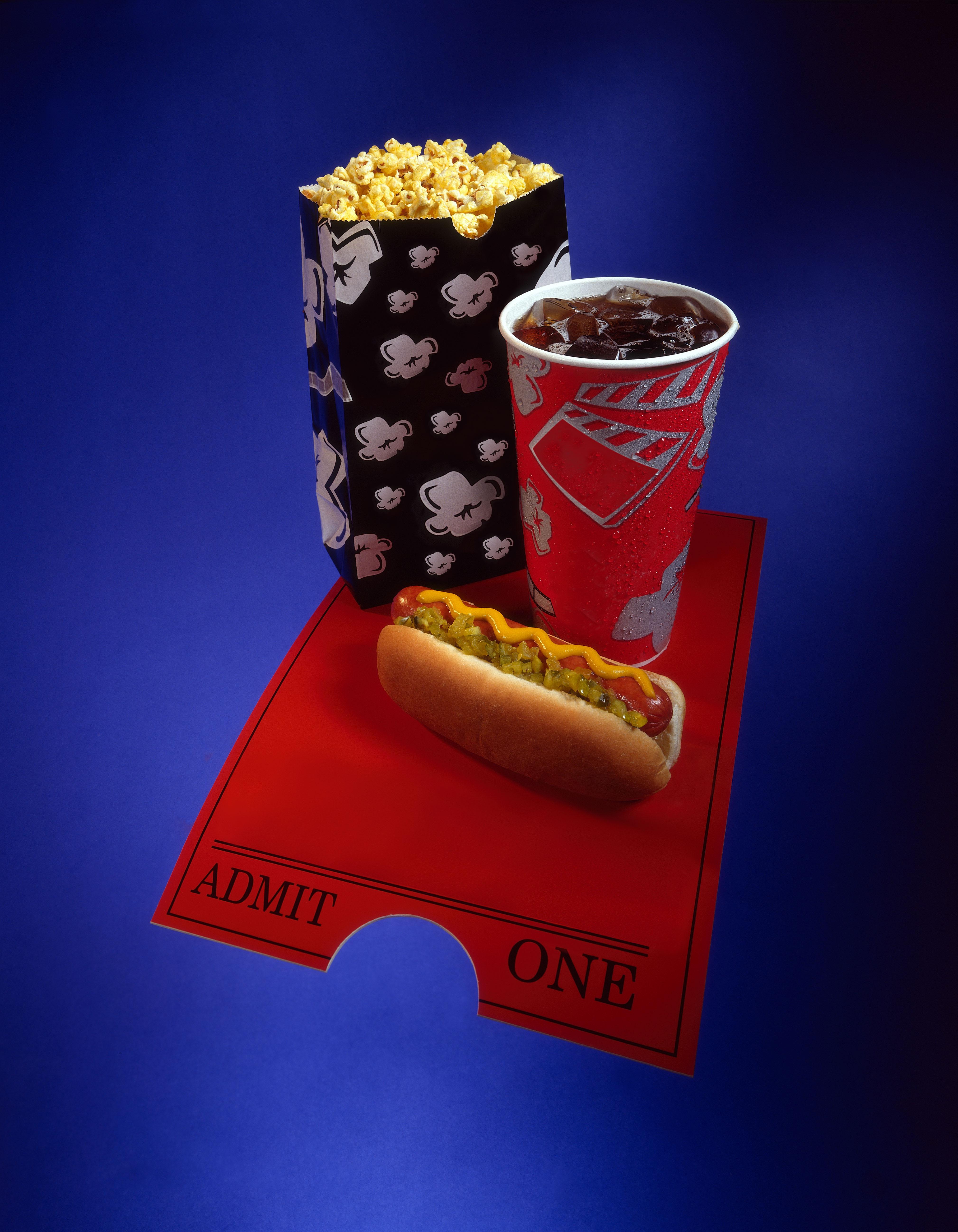 Movie theater hot dog with popcorn and soda