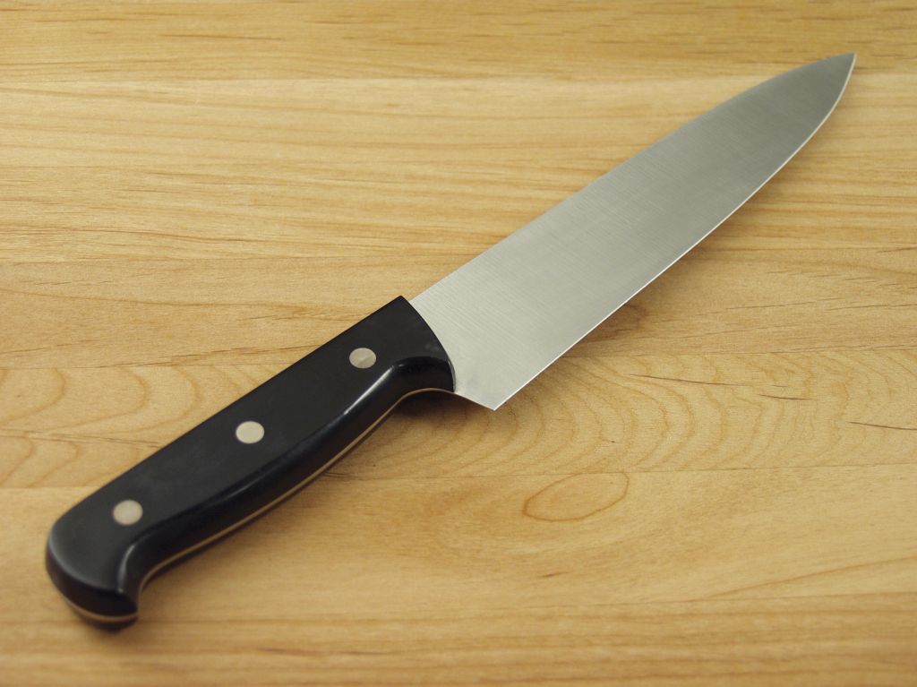 A knife placed on a cutting board