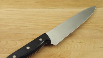 A knife placed on a cutting board