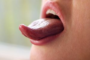 Woman sticking out tongue