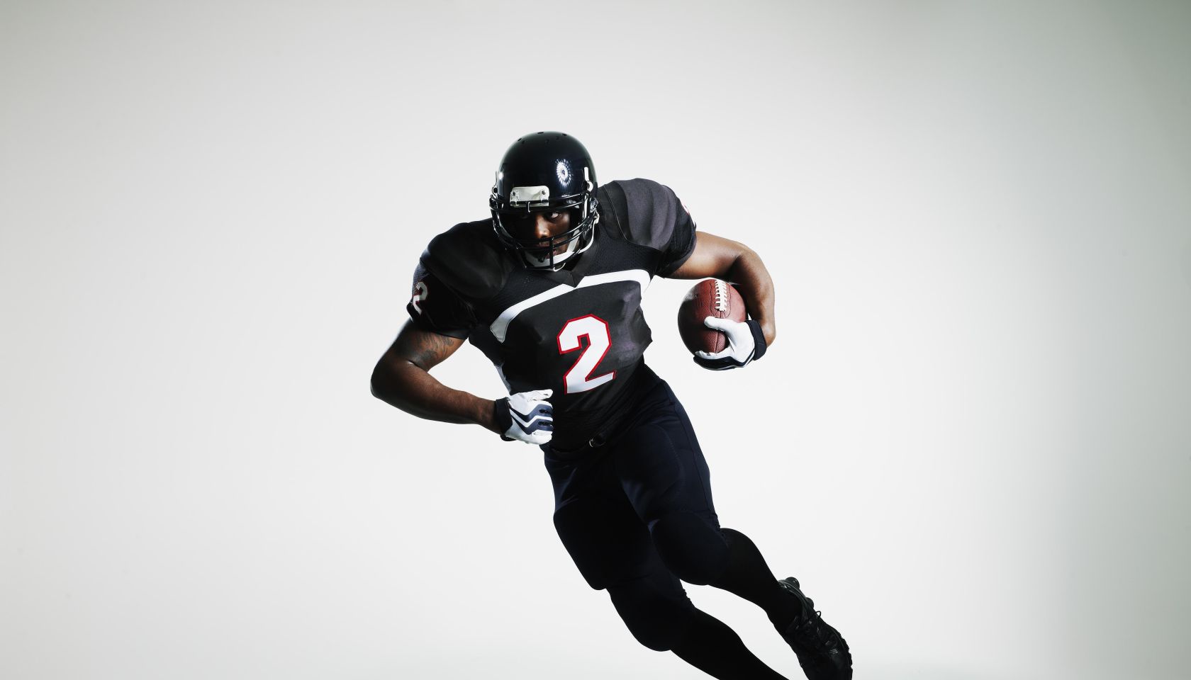Football player running with ball