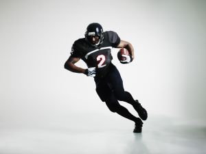 Football player running with ball