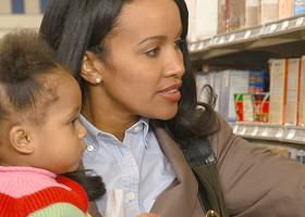 CU, Woman shopping with daughter (12-17 months), Richmond, Virginia, USA