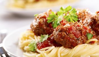 pasta with meatballs and parsley with tomato sauce