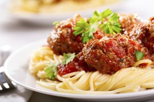 pasta with meatballs and parsley with tomato sauce