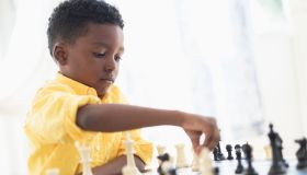 Boy (6-7) playing chess