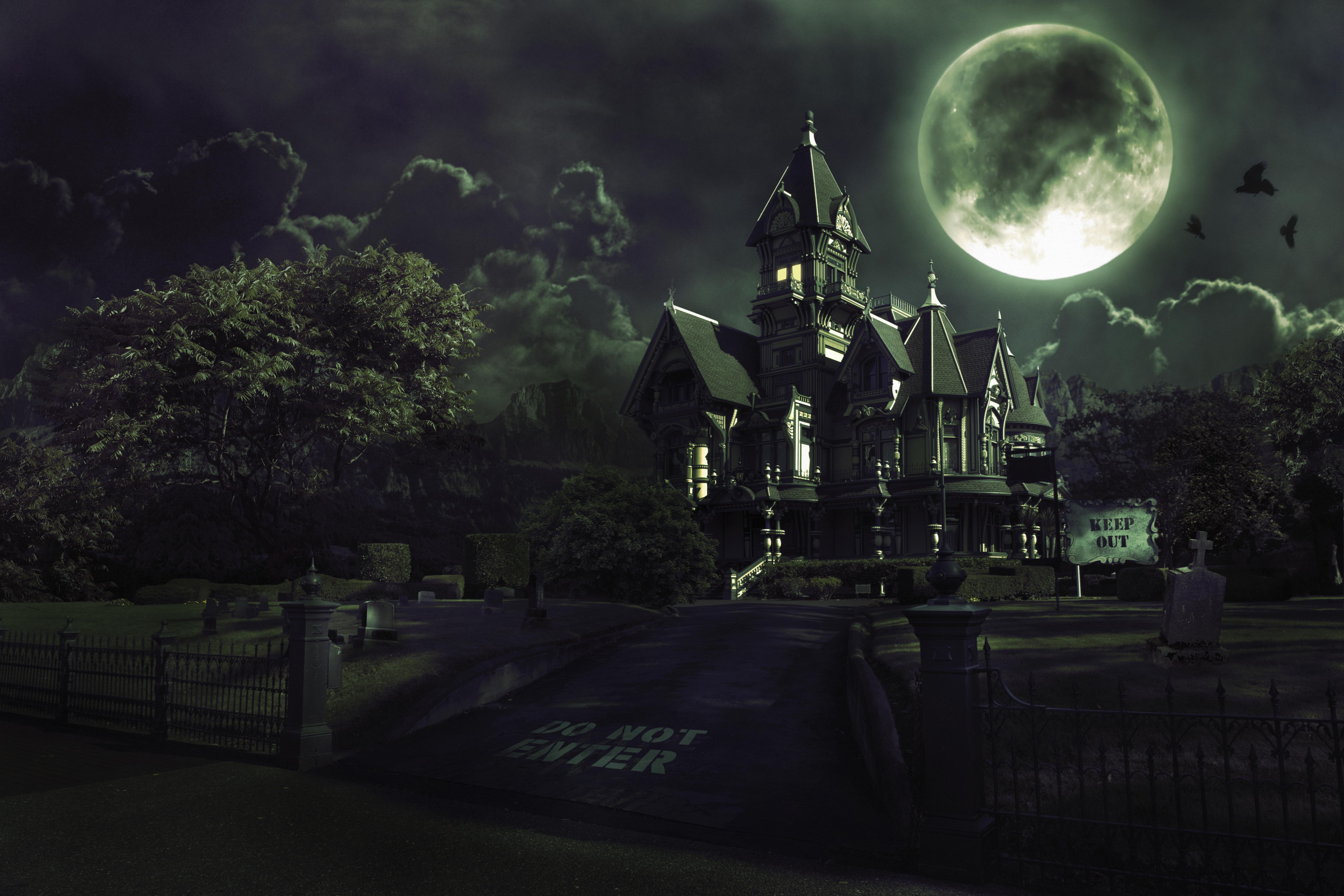 Full Moon Over Haunted House with Graveyard for Halloween
