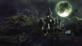 Full Moon Over Haunted House with Graveyard for Halloween