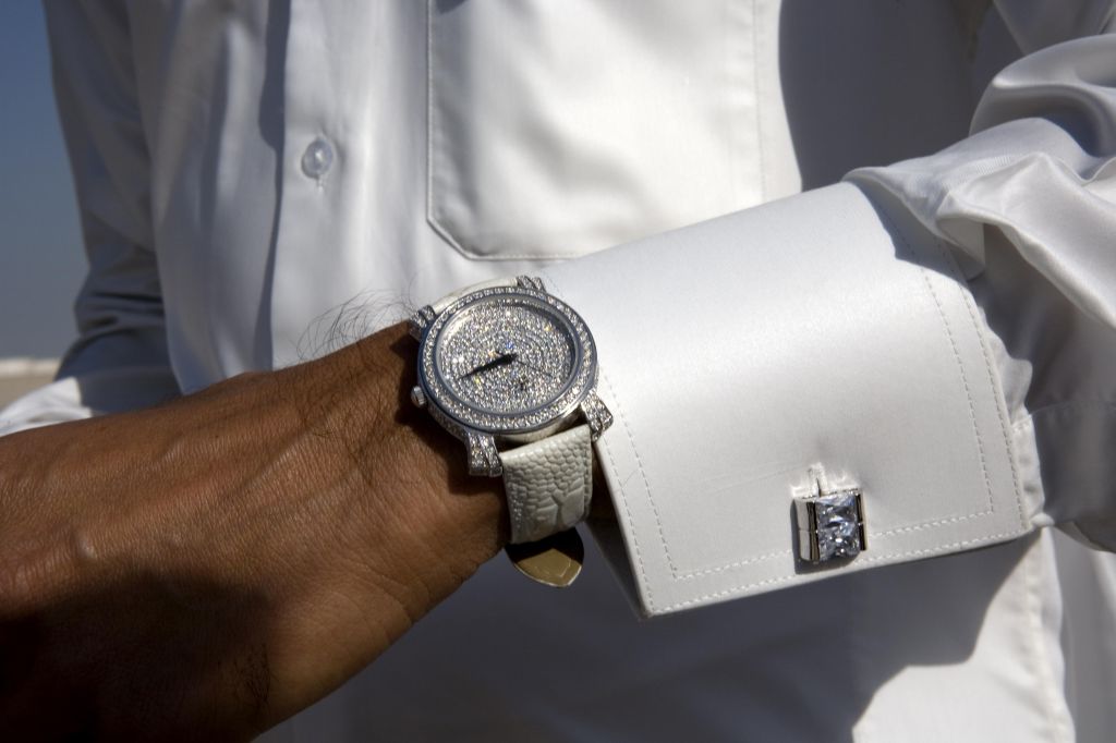 A Qatari wears a diamond-studded watch.