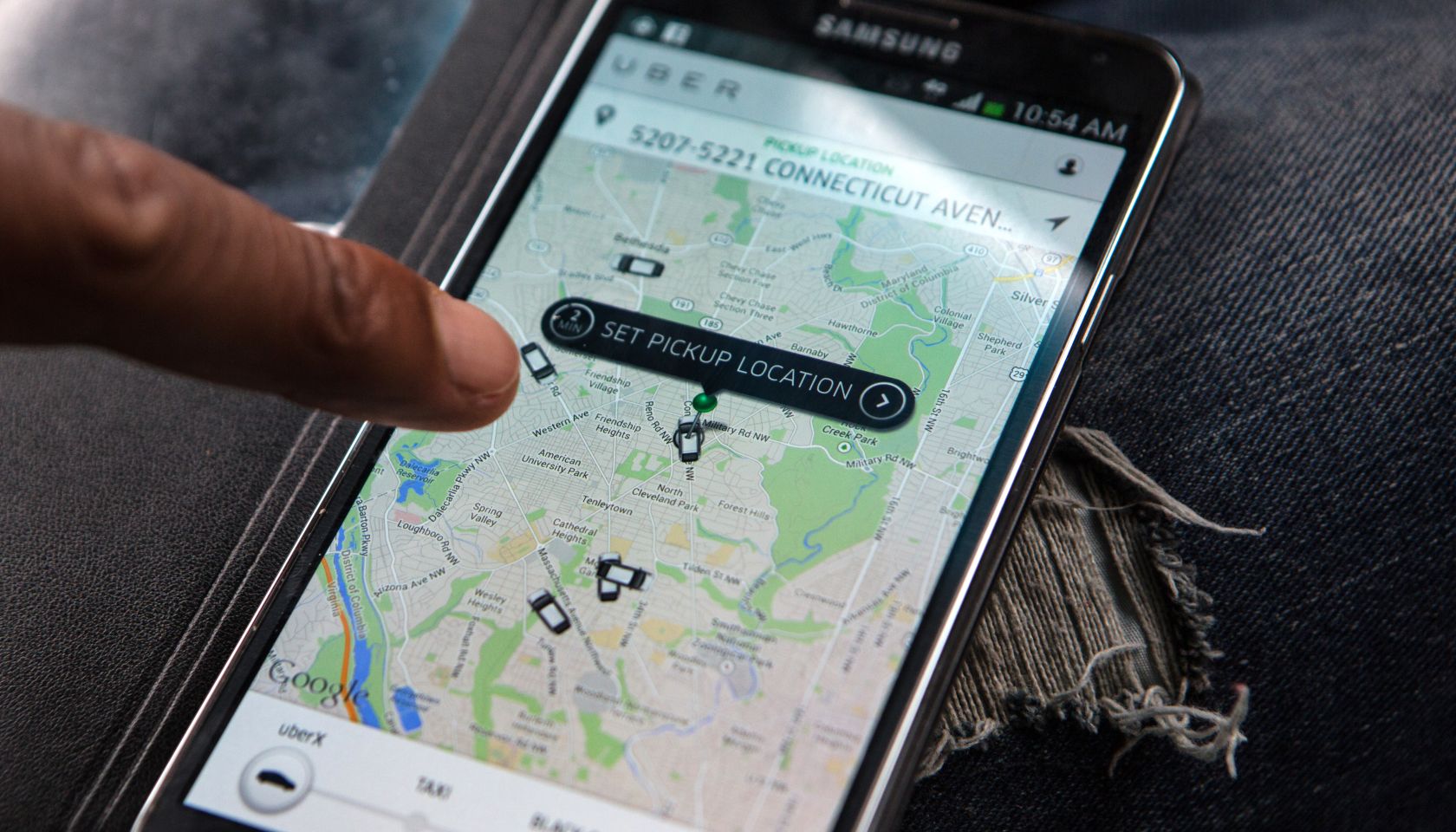 WASHINGTON, DC - APR 4: UberX driver, Michael Belet, checks th