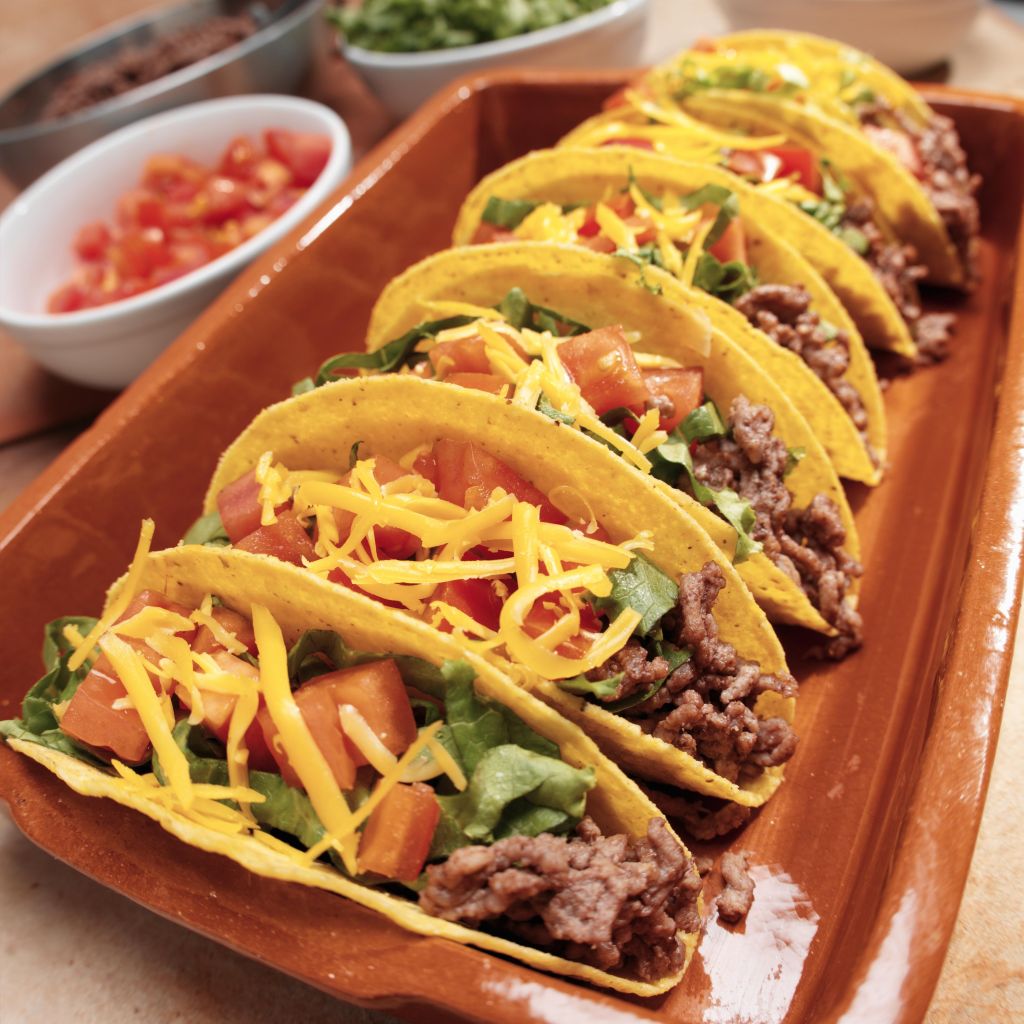 Six Beef Tacos with Lettuce, Tomato and Cheese