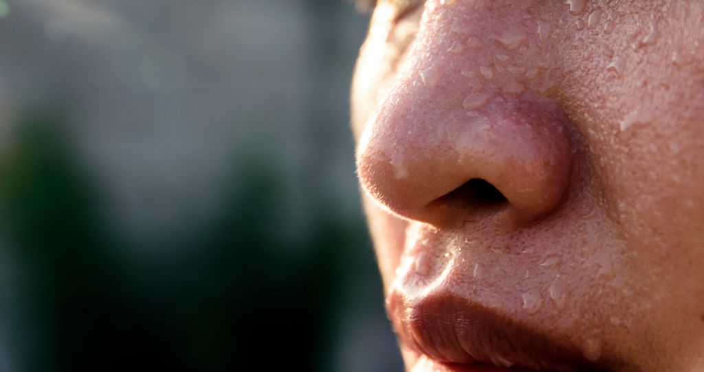 Close-Up Of Woman With Sweat On Face