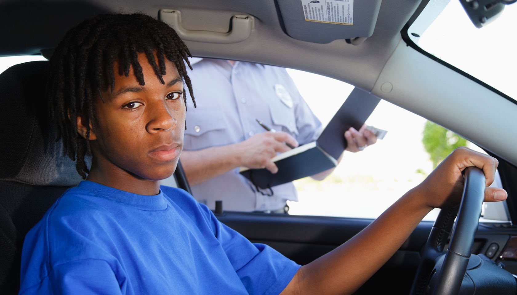 Teenage Boy Receiving a Ticket