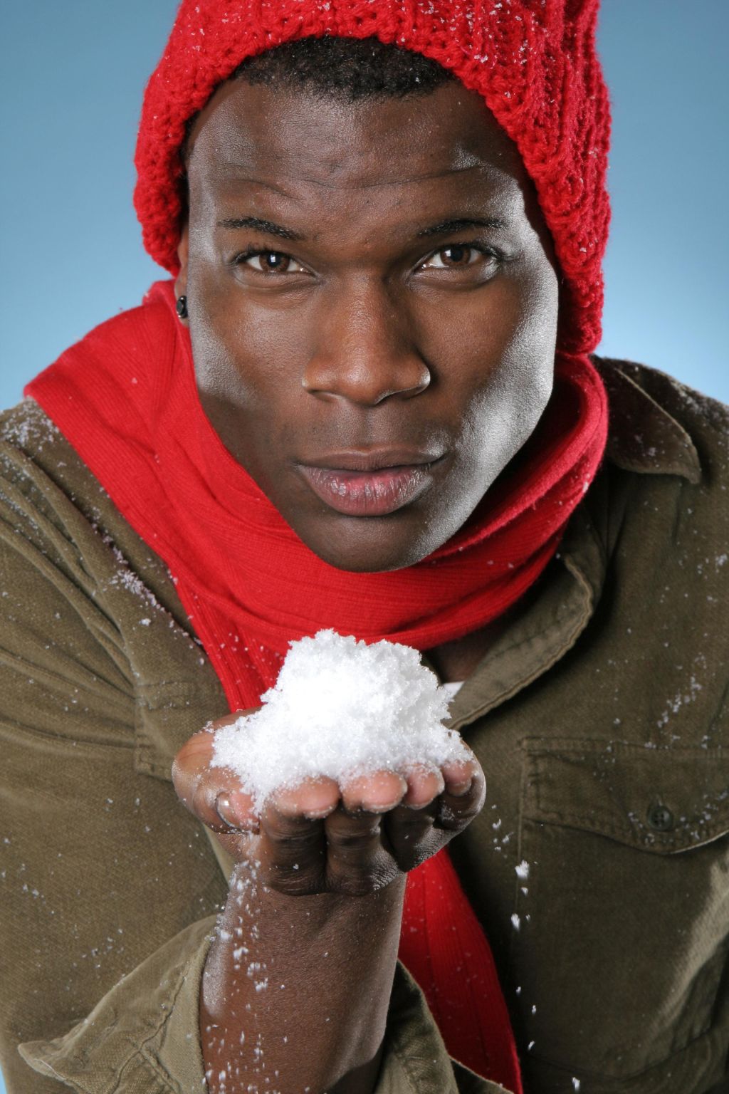 Man Holding Handful of Snow