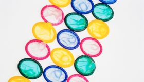 A Close-up of a Rainbow of Colourful Condoms