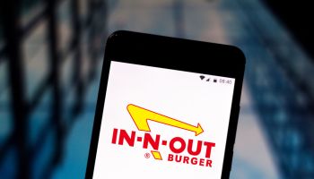 In this photo illustration an In-N-Out Burger logo seen...