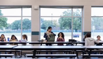 Group of schoolchildren eating lunch