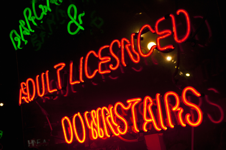 Neon sign offering adult entertainment