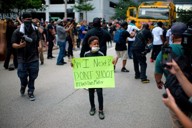 Child With Sign "Am I Next?" - Houston Protests