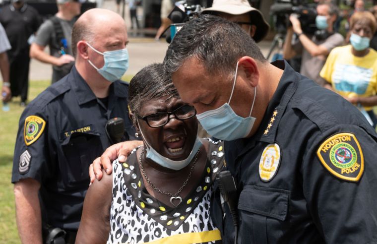Art Acevedo Prays With A Woman