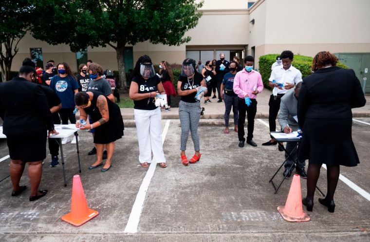 People Signing Guest Books