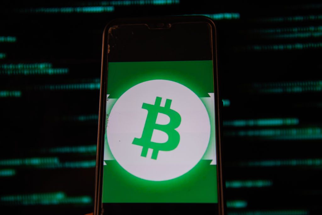 In this photo illustration a Bitcoin logo is seen displayed...