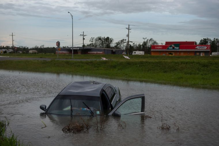 People Survey The Damage Caused By Hurricane Laura