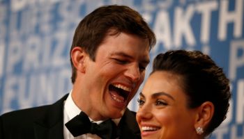 Actor Ashton Kutcher laughs with his wife actress Mila Kunis while posing for pictures on the red carpet for the 6th annual 2018 Breakthrough Prizes at Moffett Federal Airfield, Hangar One in Mountain View, Calif., on Sunday, Dec. 3, 2017. (Nhat V. Meyer/