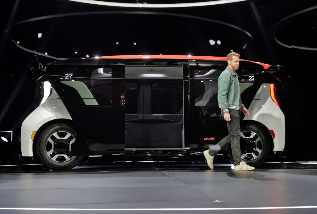 Kyle Vogt, walks past the new Cruise Origin, at the unveiling of the fully autonomous passenger vehicle in San Francisco, Calif., on Tuesday, January 21, 2020