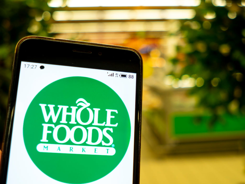 In this photo illustration the Whole Foods logo is seen...