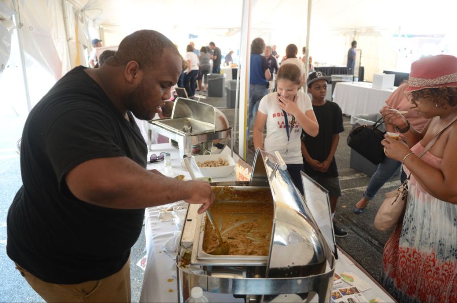 Evan Walton, Food and Beverage Manager for the Courtyard Marriott, serves up some of his peanut chili.During the 2013 VF Food Truck Festival and Chili Cook Off in the parking lot of the VF Designer Place Saturday afternoon.10/5/2013 Wy