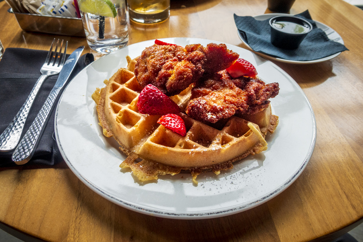 Golden, crispy fried chicken piled on a fluffy waffle