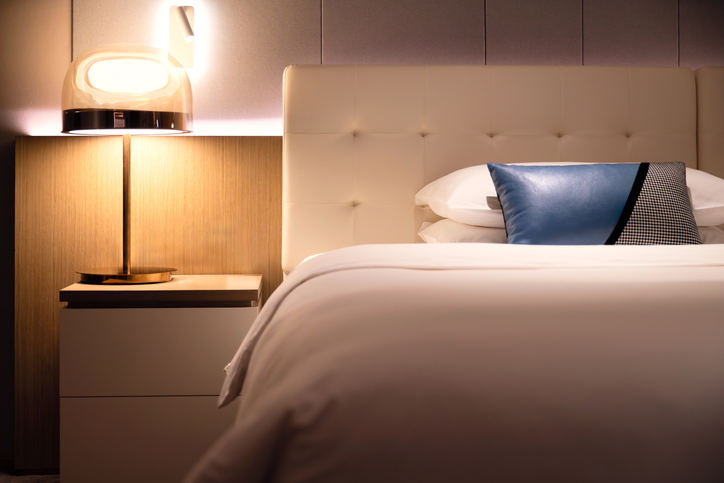 Comfortable bed in modern hotel.