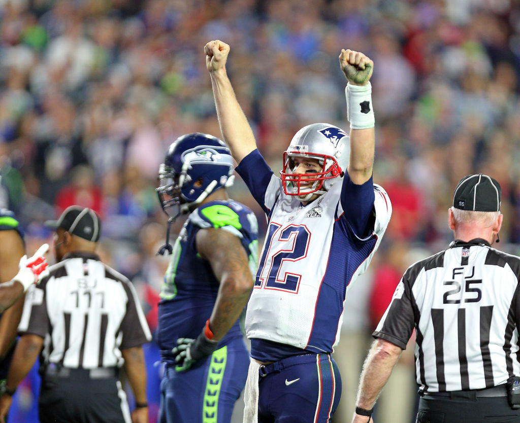 (020215 Glendale, AZ) New England Patriots quarterback Tom Brady signals the win at the end of the game as the New England Patriots take on the Seattle Seahawks in Super Bowl XLIX in Glendale, AZ. (Monday,February 2, 2015). Staff Photo by Nancy Lan