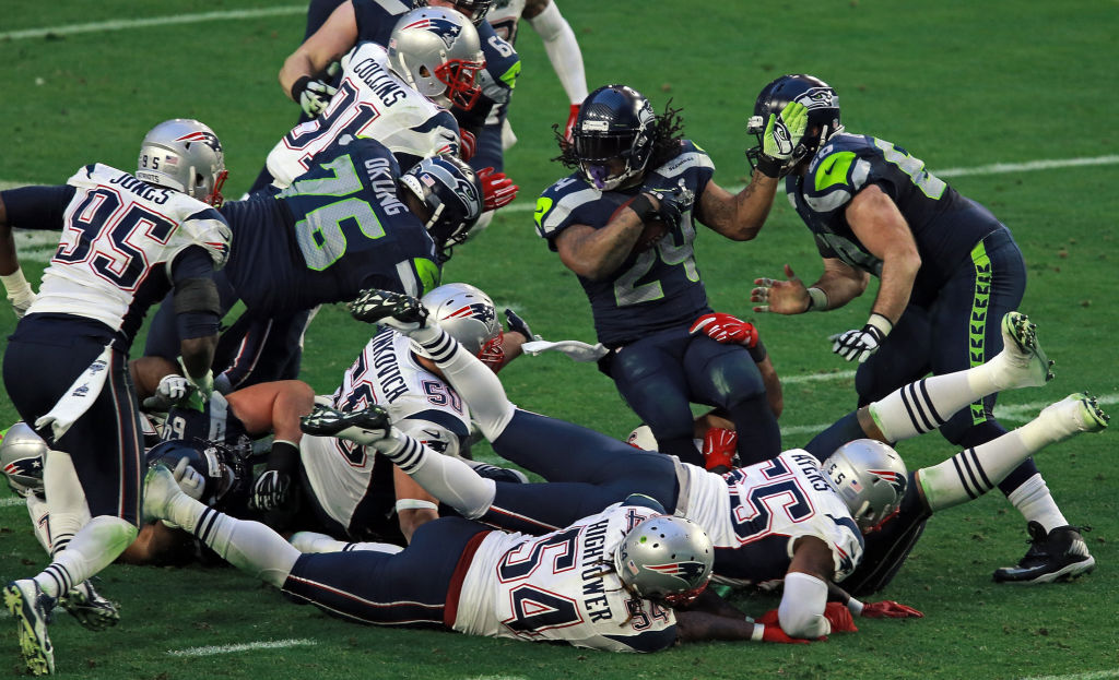 (Glendale, AZ, 02/01/15) Seattle Seahawks running back Marshawn Lynch gets some extra yards as the New England Patriots take on the Seahawks at Super Bowl XLIX at the University of Phoenix Stadium Sunday, February 01, 2015. Staff Photo by Matt St