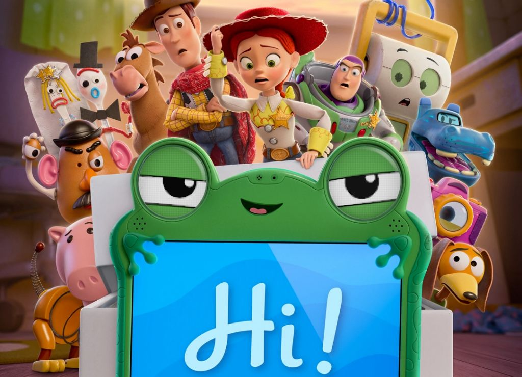 Colorful animated characters from the Toy Story franchise, including Woody, Buzz Lightyear, and others, surrounding a green frog-like character holding a sign that says "Hi!