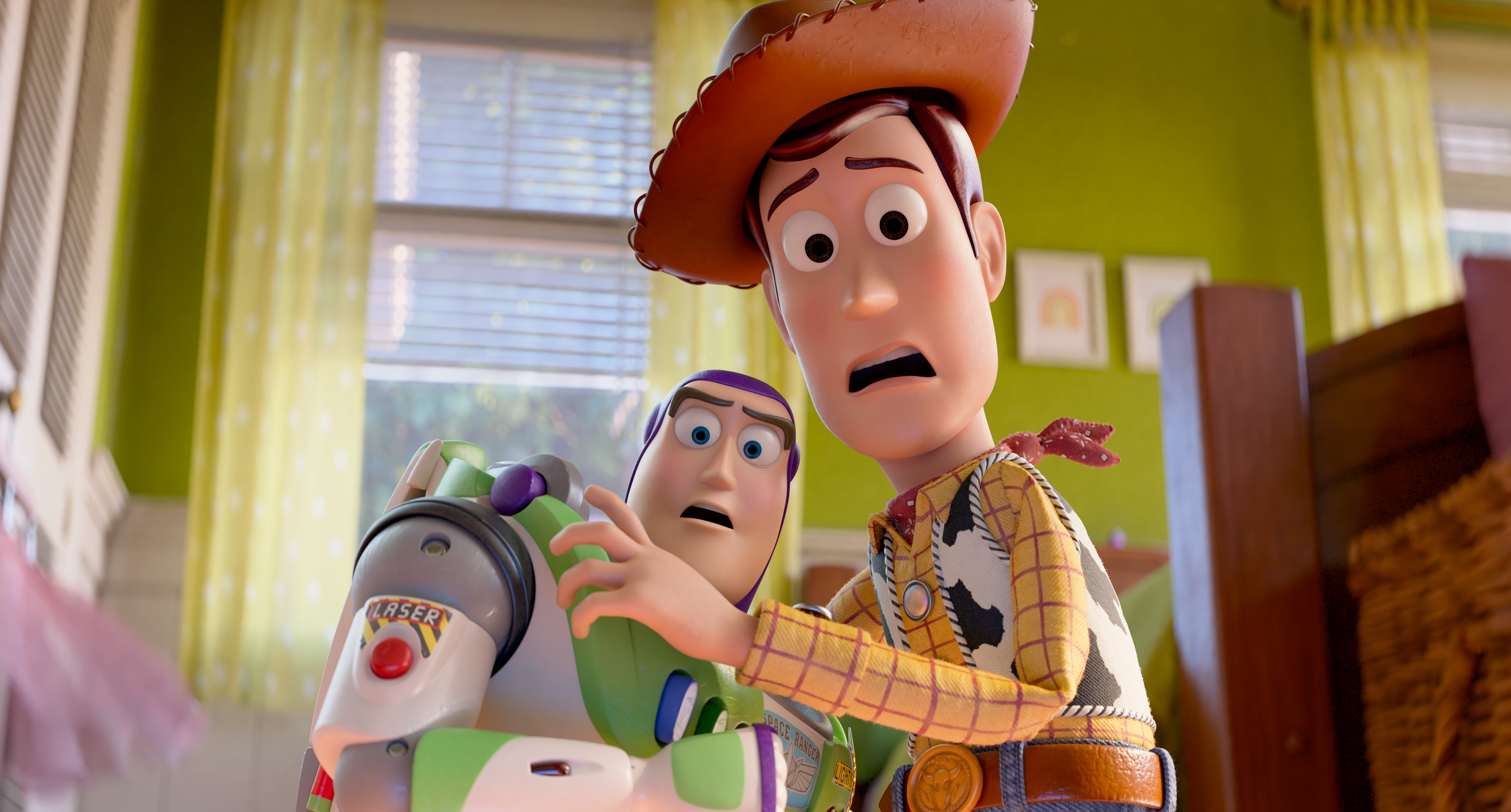 Two animated characters, Buzz Lightyear and Woody, with shocked expressions on their faces in a room with green walls.