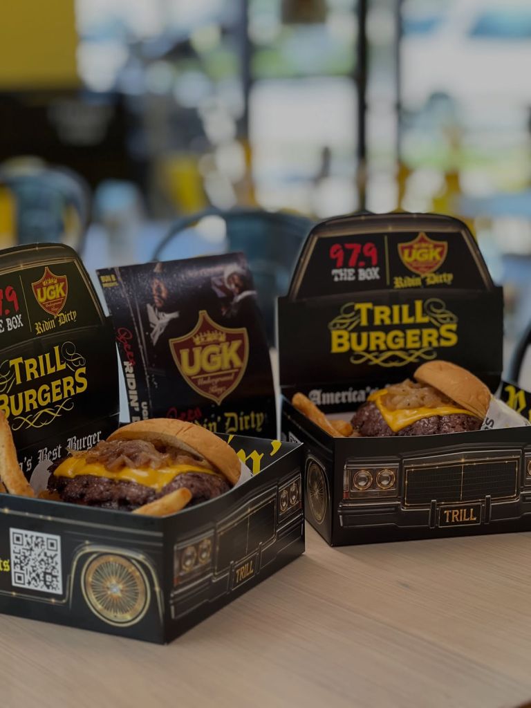 Trill Burgers fast food packaging featuring the Trill brand logo and images of cheeseburgers.