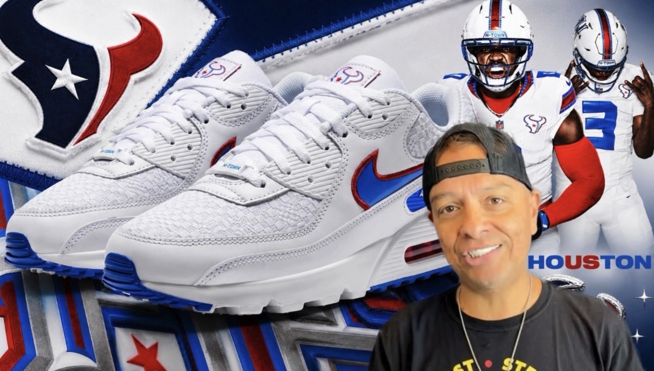 A man smiling and wearing a Houston Texans hat stands in front of a display featuring Houston Texans football gear and Nike Air Max 90 sneakers.